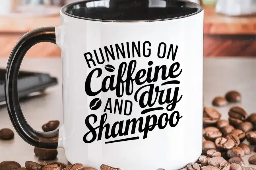 White Coffee Mug With Black Handle And Text That Reads Running On Caffeine And Dry Shampoo.