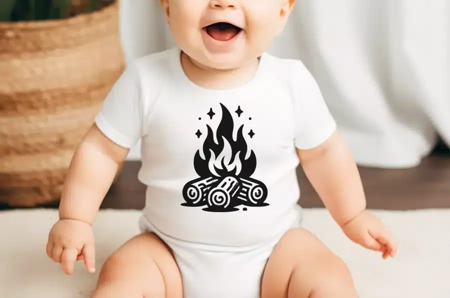 Baby Wearing A White Onesie With A Black Campfire Design.