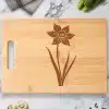 A Cutting Board With A Flower On It