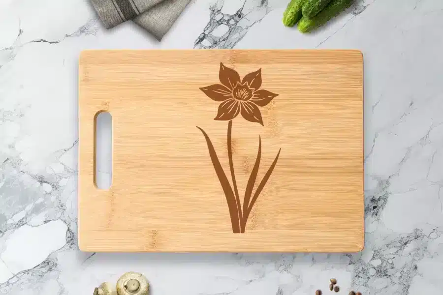 A Cutting Board With A Flower On It