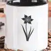 A Coffee Mug With A Flower On It