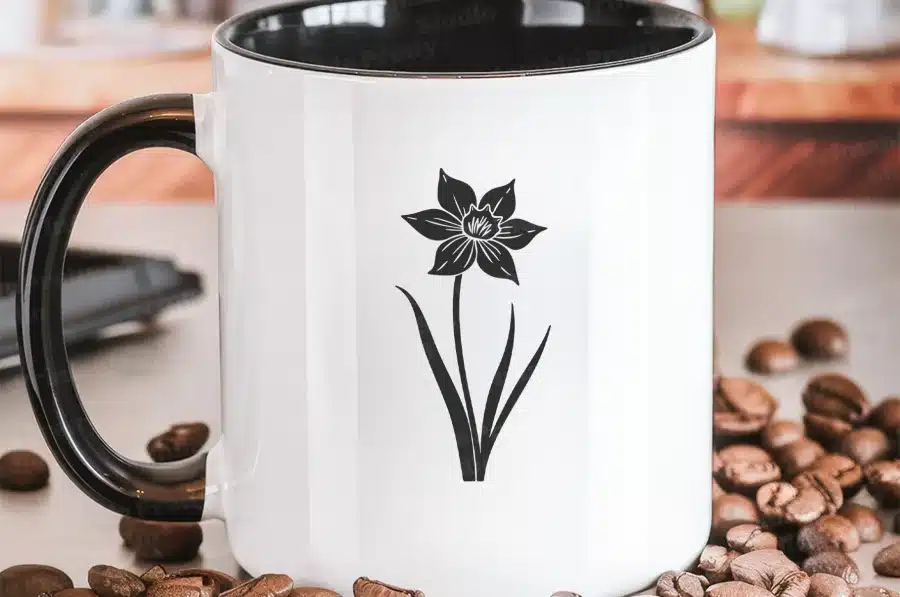 A Coffee Mug With A Flower On It