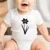 A Baby With A Flower On It