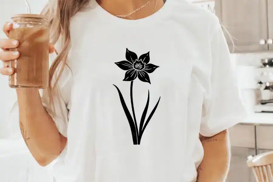 A Person Wearing A White Shirt With A Flower On It