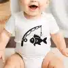 Baby Wearing A White Onesie With A Black Fish And Fishing Rod Design.