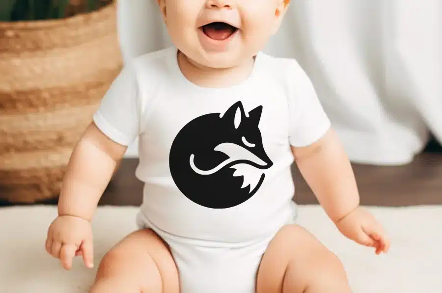 Baby Wearing A White Bodysuit With A Black Fox Design.