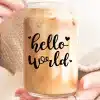 A Person Holding A Glass Of Liquid