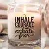 A Candle In A Glass Container