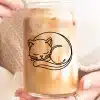 A Glass Of Iced Coffee Featuring A Line Drawing Of A Sleeping Cat.