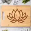 Wooden Cutting Board With A Brown Lotus Flower Design.