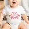 Baby Wearing A White Onesie With A Pink Lotus Flower Design.