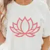 Woman Wearing A White T-Shirt With A Pink Lotus Flower Design.