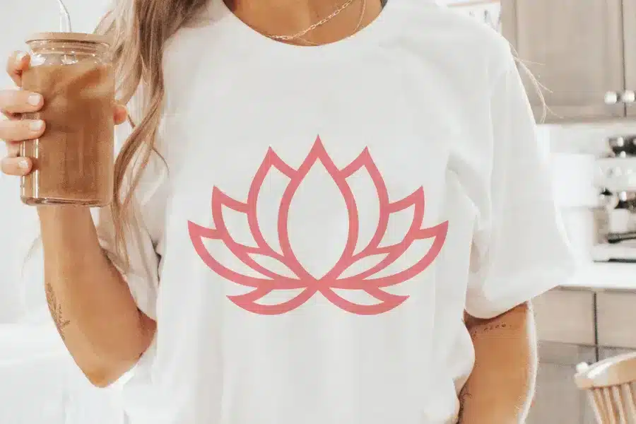 Woman Wearing A White T-Shirt With A Pink Lotus Flower Design.