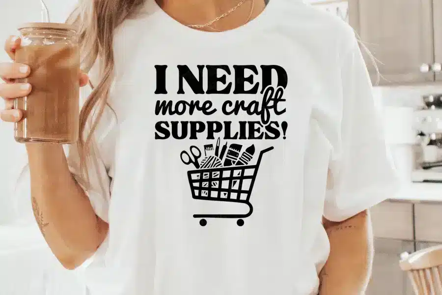 a person wearing a white shirt with a black text on it