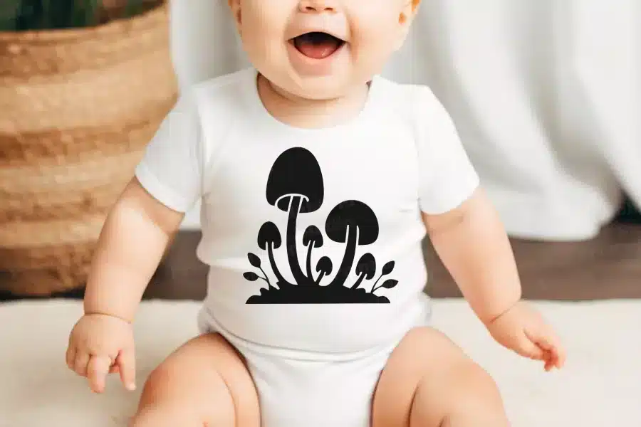 A Baby With A Mushroom Design On It