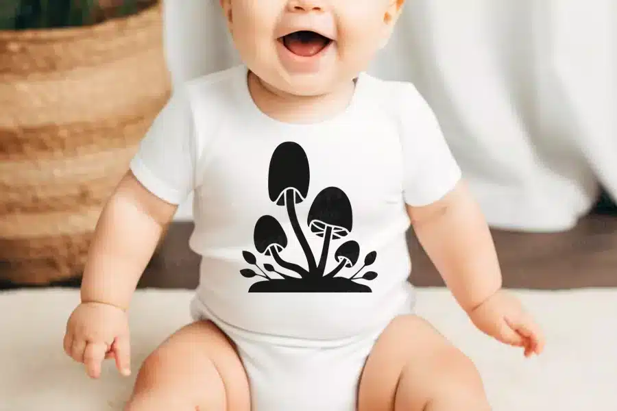A Baby With A Mushroom Design On It