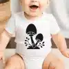 A Baby With A Mushroom Design On It