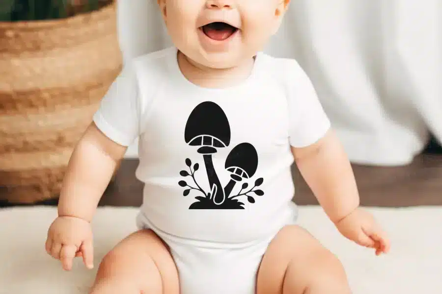 A Baby With A Mushroom Design On It