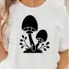 A Person Wearing A White Shirt With A Black Mushroom On It
