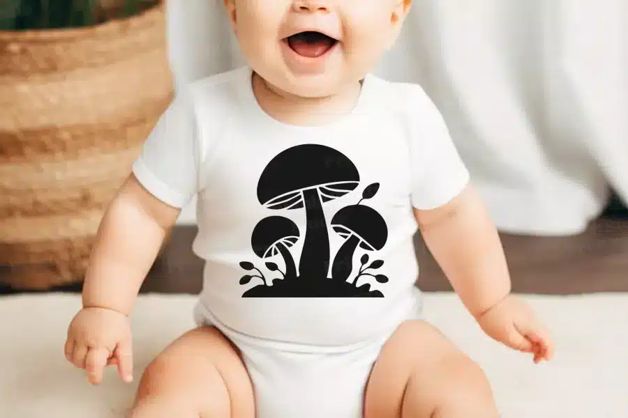 A Baby With A Mushroom Design On It