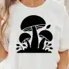 A Woman Wearing A White Shirt With A Black Mushroom Design