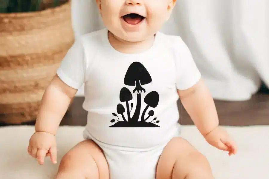 A Baby With A Mushroom Design On It
