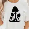 A Person Wearing A White Shirt With A Black Mushroom On It