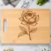 Bamboo Cutting Board With Engraved Floral Design.