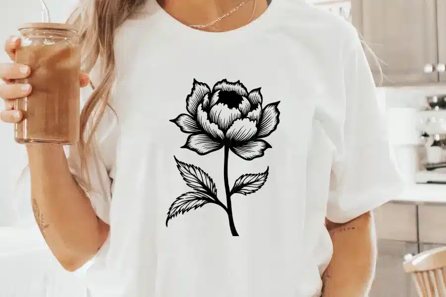 A Woman Wearing A White T-Shirt With A Black Line Drawing Of A Rose.