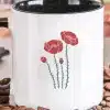 White Coffee Mug With Black Handle, Featuring A Simple Design Of Red Poppies.