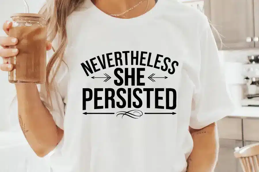 a woman wearing a white shirt with black text