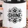 White Coffee Mug With Black Handle, Featuring A Design Of Stars And The Text Shine Bright.