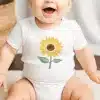 Baby Wearing A White Onesie With A Sunflower Design.