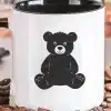 White Coffee Mug With Black Handle, Featuring A Black Silhouette Of A Teddy Bear.