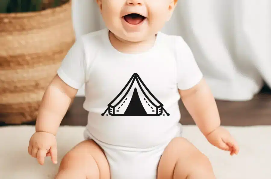 Baby Wearing A White Onesie With A Black Tent Graphic.
