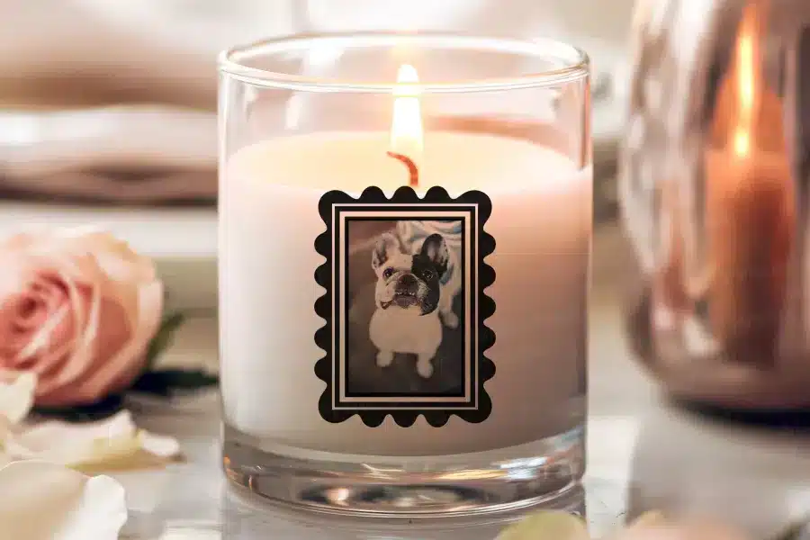 a candle with a picture of a dog on it
