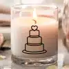 A Lit Candle In A Clear Glass Jar, Decorated With A Simple Line Drawing Of A Three-Tiered Wedding Cake Topped With A Heart.