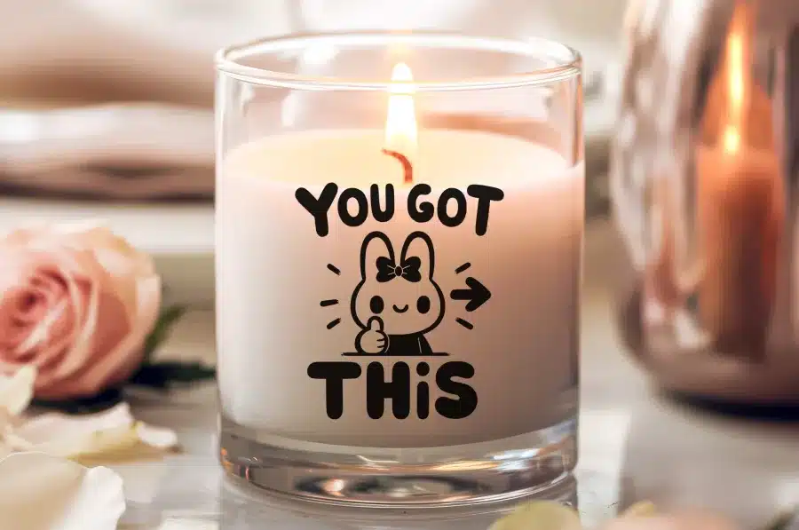 A Lit Candle In A Glass Jar With The Text You Got This And An Illustration Of A Cheerful Bunny Giving A Thumbs Up.